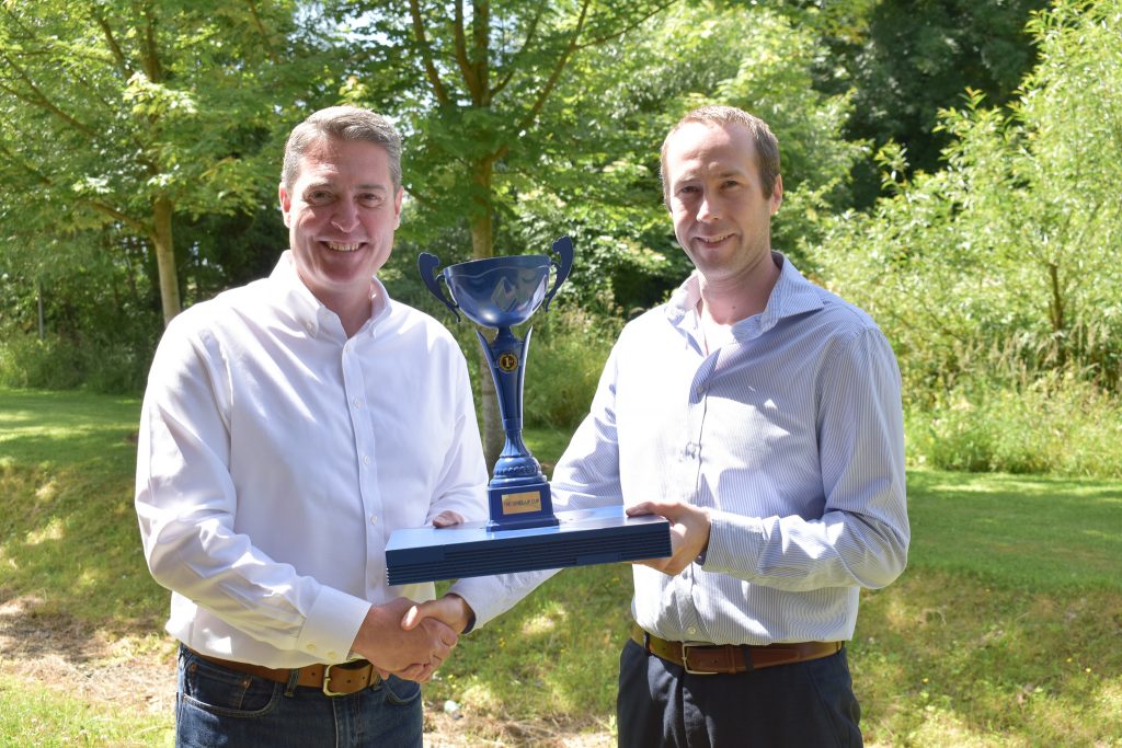 eve Networks Managing Director Steve Barclay presenting the Level Up Cup to Chris McNamee, Lead Developer.