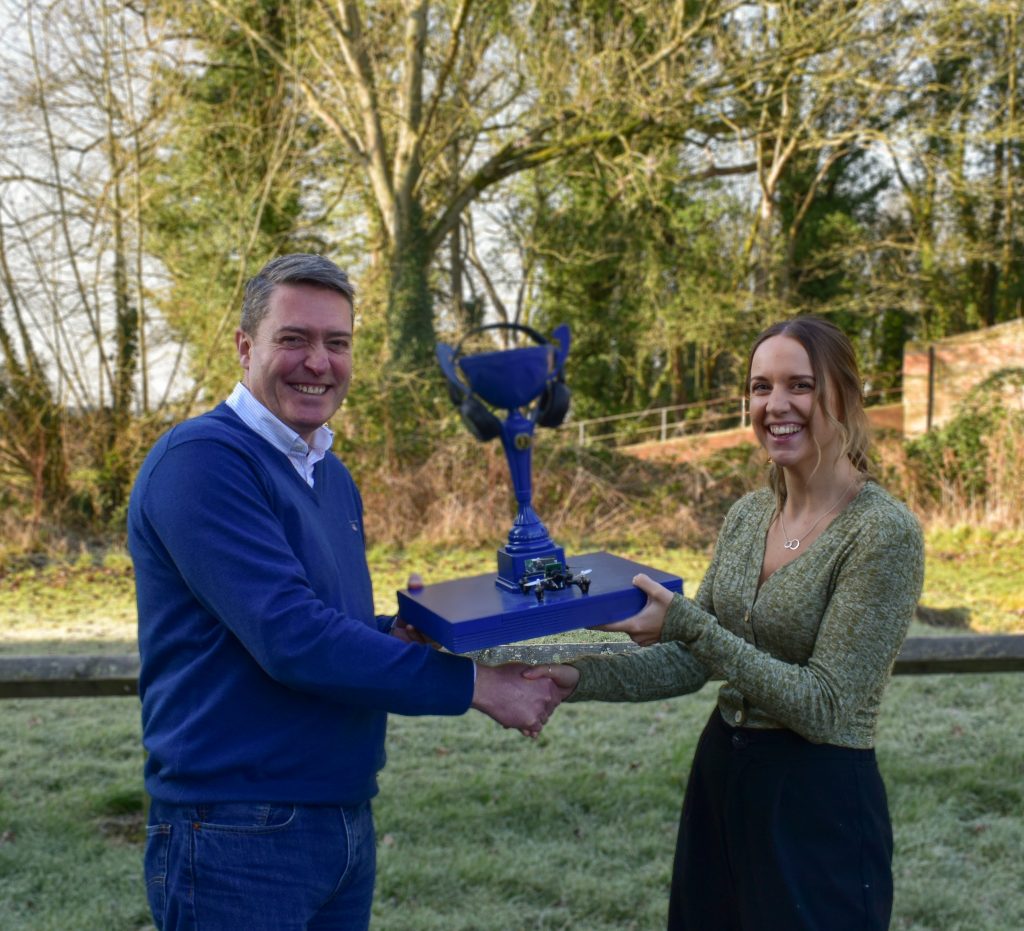 eve Networks Managing Director Steve Barclay presenting the Level Up Cup to Beth Swarbrick, Campaign Manager.